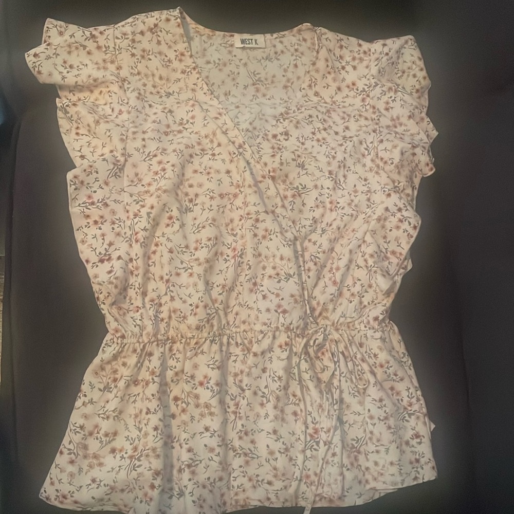 Large West K cross over shirt.